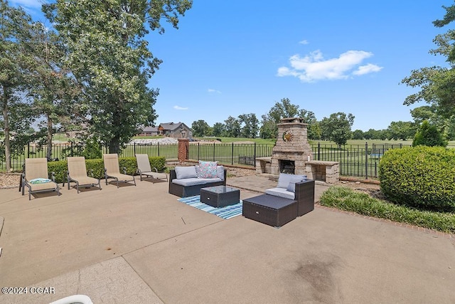 view of patio / terrace featuring an outdoor living space with a fireplace