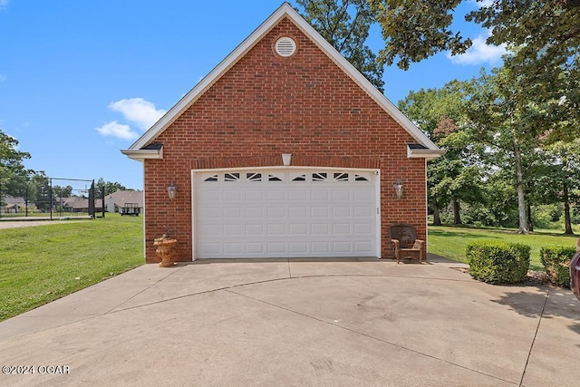 garage featuring a yard