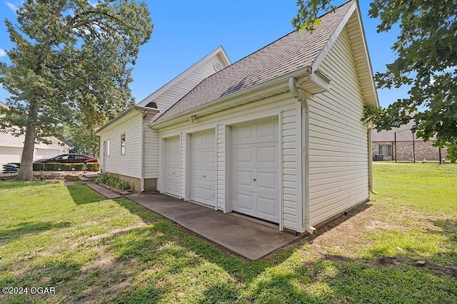 garage featuring a yard