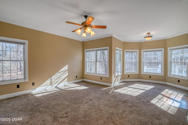 unfurnished living room featuring light carpet, ornamental molding, and ceiling fan