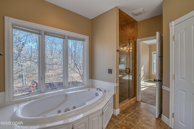 bathroom featuring separate shower and tub and tile patterned floors