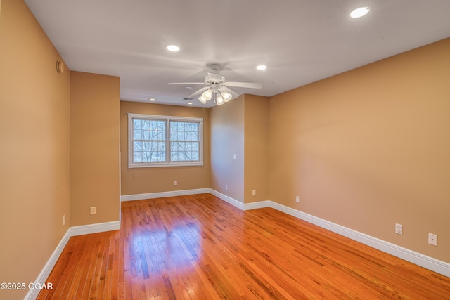 unfurnished room with ceiling fan and light hardwood / wood-style floors