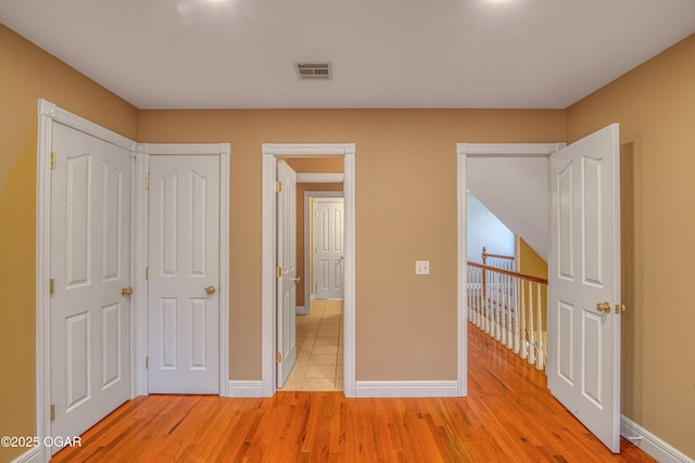 unfurnished bedroom with light hardwood / wood-style flooring