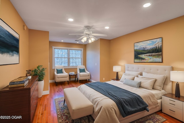 bedroom with hardwood / wood-style floors and ceiling fan