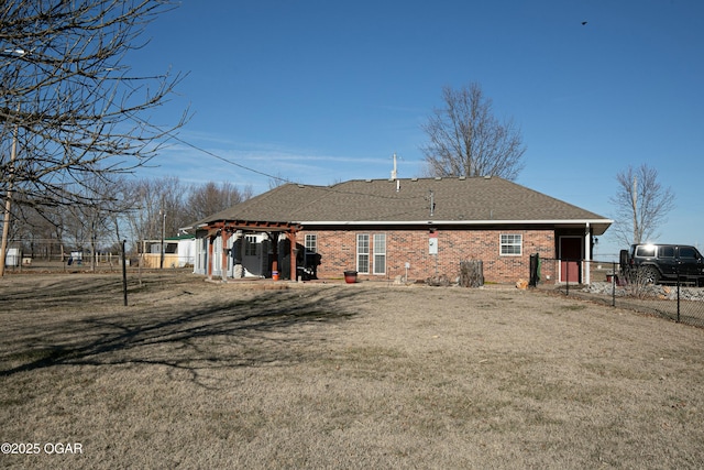 back of house featuring a lawn