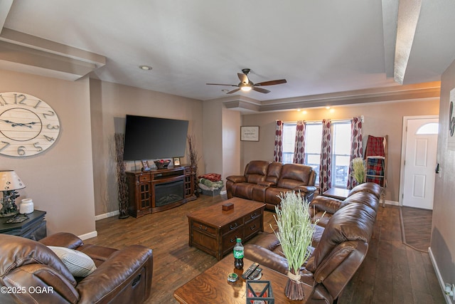 living room with dark hardwood / wood-style flooring and ceiling fan