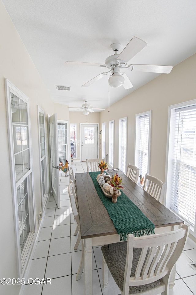 dining room featuring light tile patterned flooring