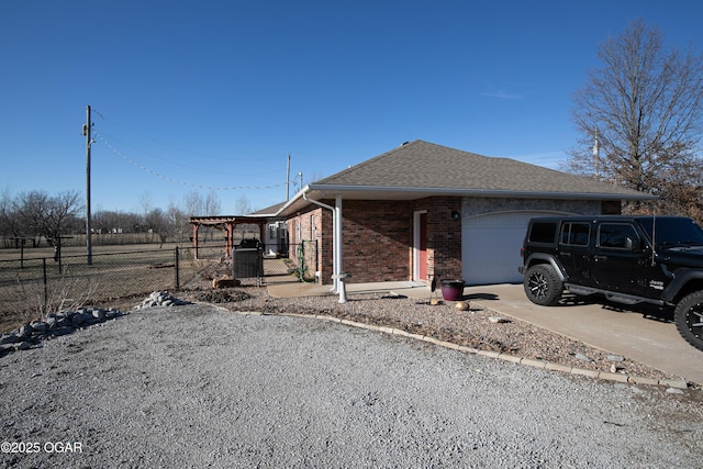 view of side of property with a garage