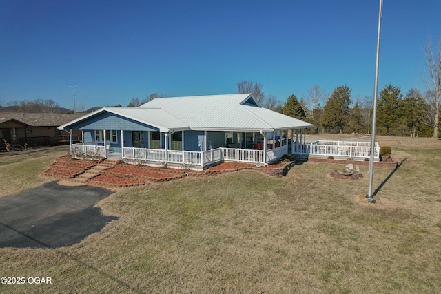 farmhouse-style home with a front yard and a porch