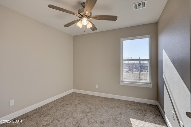 carpeted empty room featuring ceiling fan