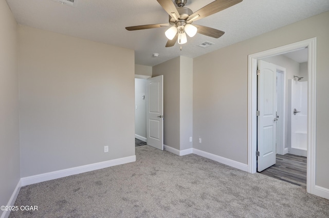 unfurnished bedroom with light colored carpet and ceiling fan