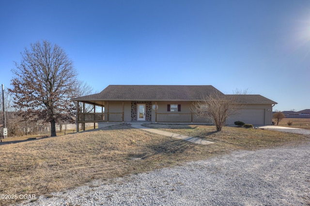 ranch-style home featuring a garage