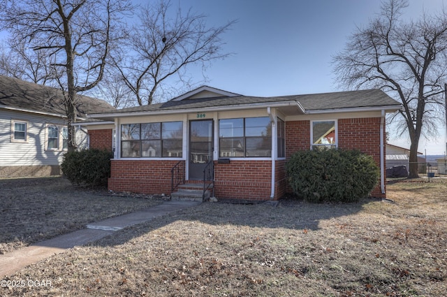 view of front of home with a sunroom