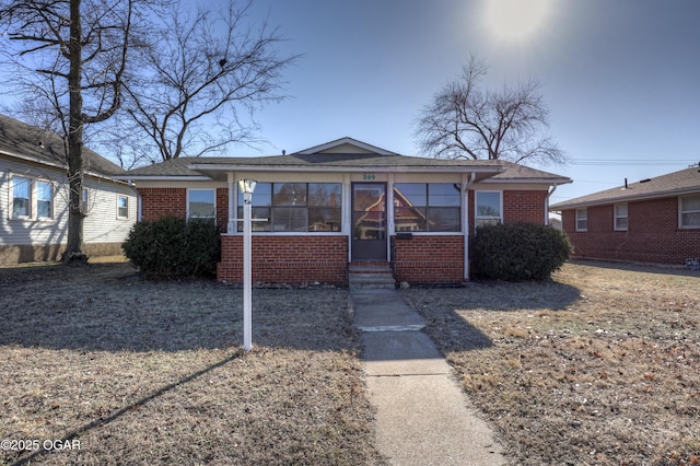 view of front of house featuring a sunroom