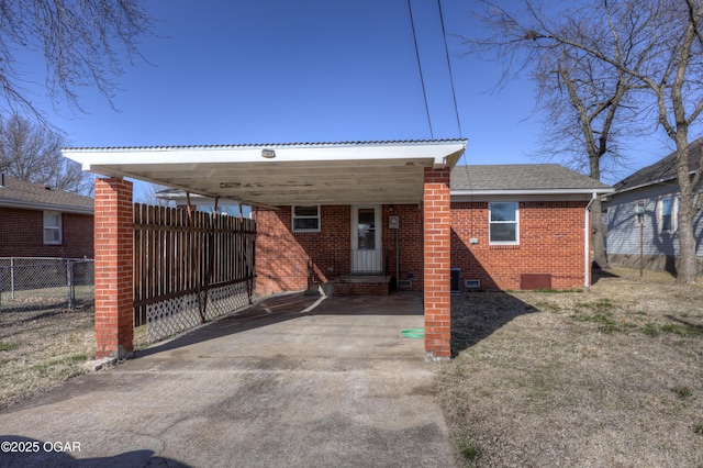 rear view of property with a carport