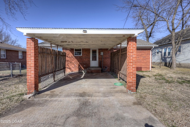 rear view of property featuring a carport