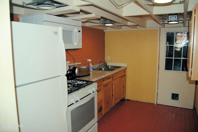 kitchen with sink and white appliances