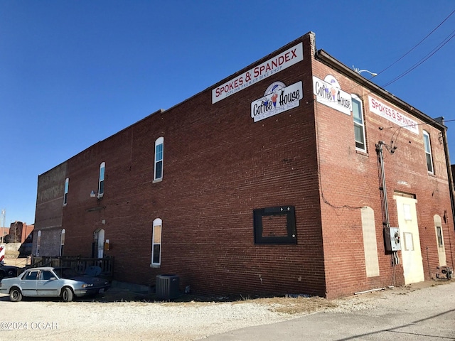 view of building exterior with central AC