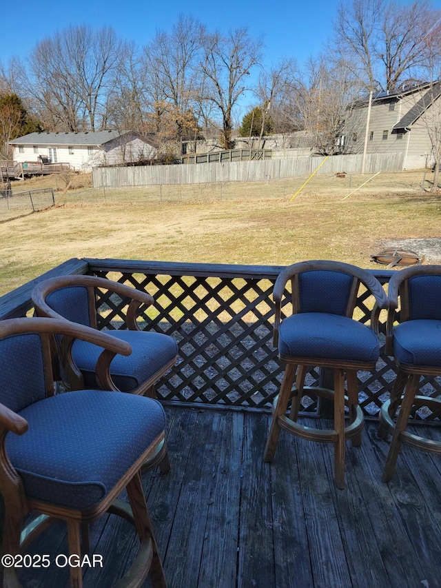 wooden terrace with a yard