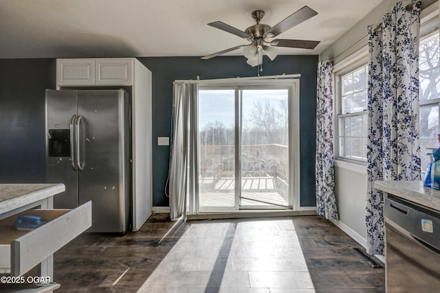 kitchen featuring white cabinetry, stainless steel refrigerator with ice dispenser, dark hardwood / wood-style floors, and ceiling fan