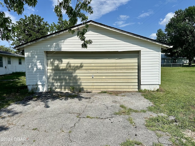 garage with a yard