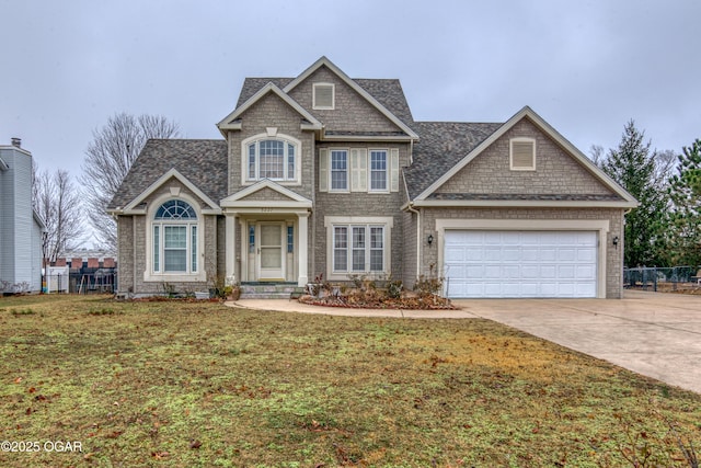 craftsman inspired home with a garage and a front yard