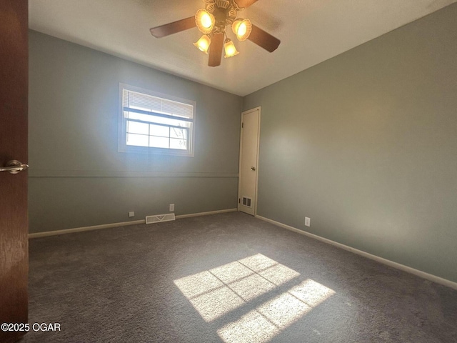 spare room featuring ceiling fan and carpet flooring