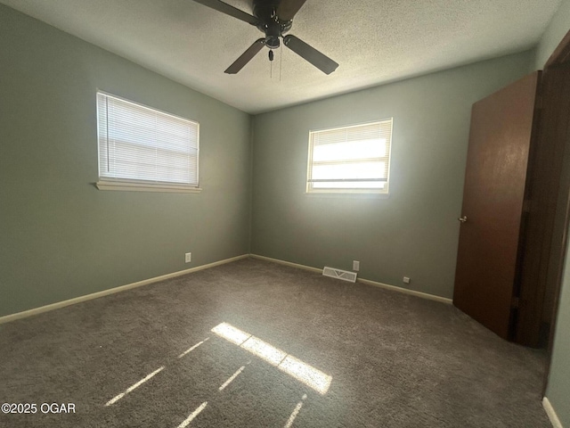 empty room with carpet flooring and ceiling fan