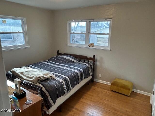 bedroom with light hardwood / wood-style floors