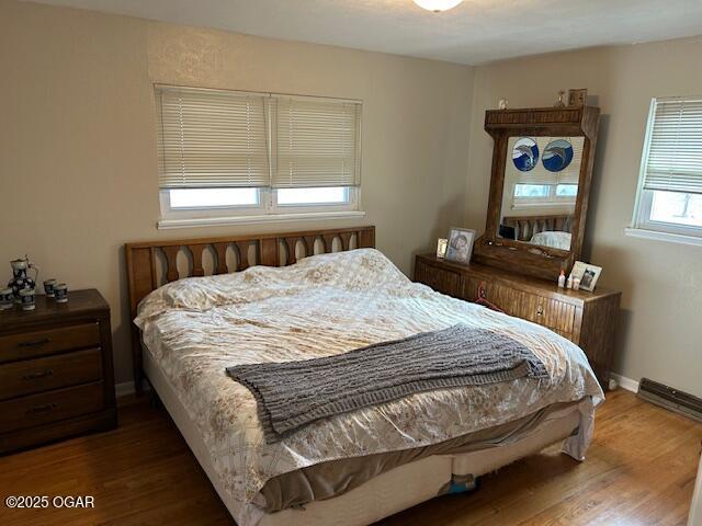 bedroom featuring dark wood-type flooring