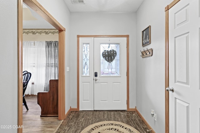 entryway with hardwood / wood-style floors