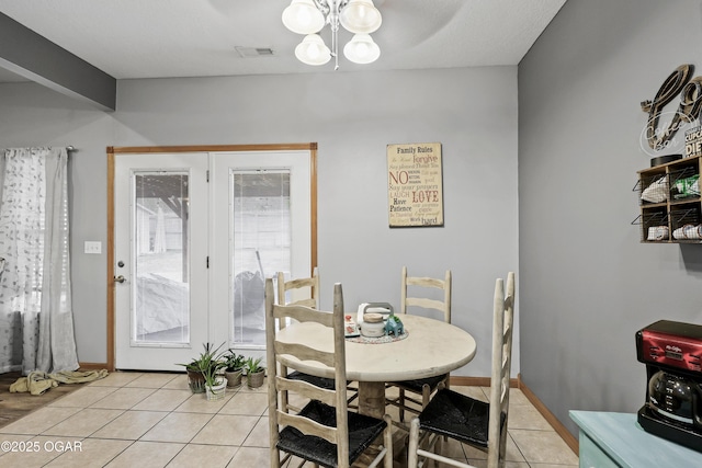 dining space with light tile patterned flooring