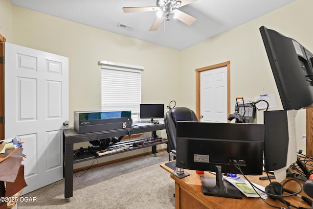 office area with ceiling fan and light carpet