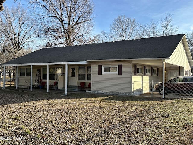 view of front of property with a carport and covered porch