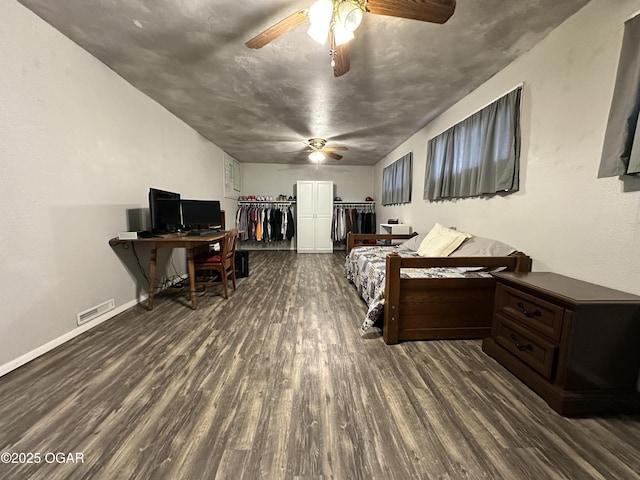 bedroom featuring ceiling fan and dark hardwood / wood-style flooring