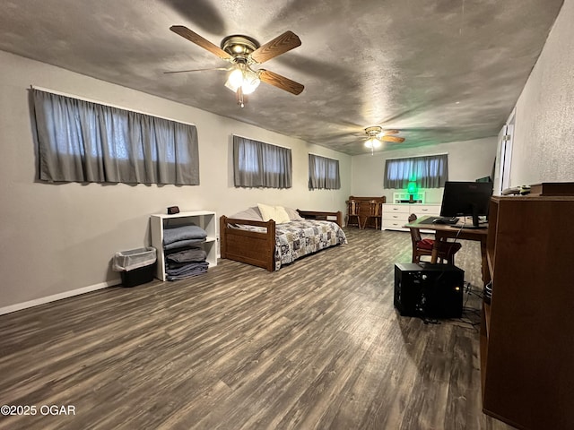 bedroom featuring dark hardwood / wood-style floors and ceiling fan