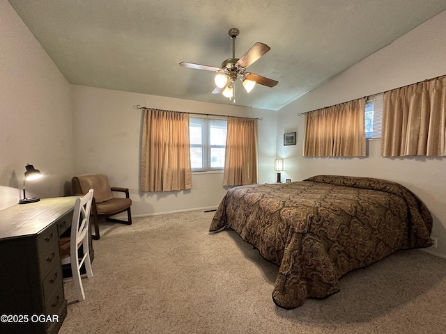 carpeted bedroom featuring lofted ceiling and ceiling fan