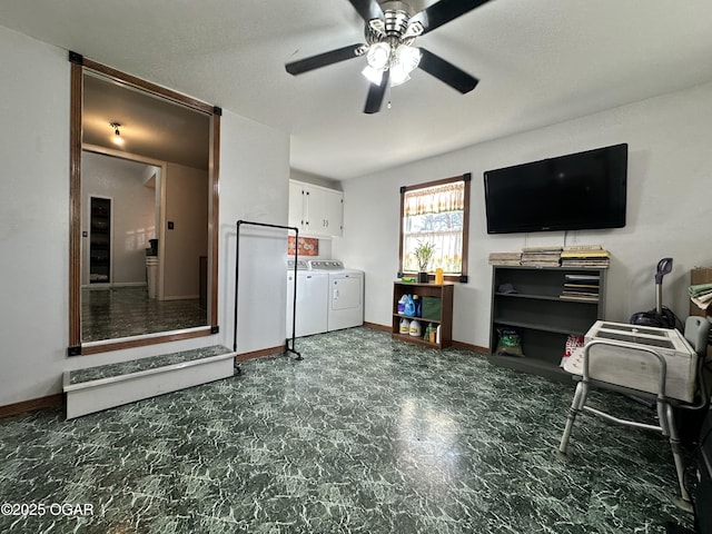 interior space with separate washer and dryer and ceiling fan