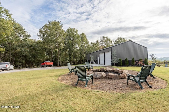 view of yard featuring an outbuilding and a garage