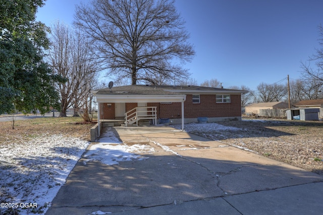 view of front of home with a carport