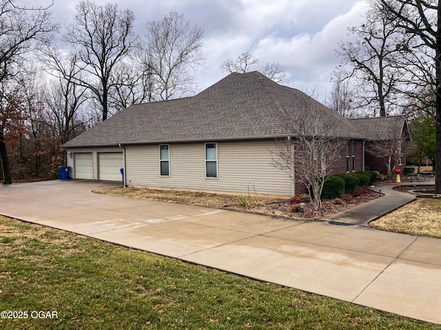 view of side of property with a garage