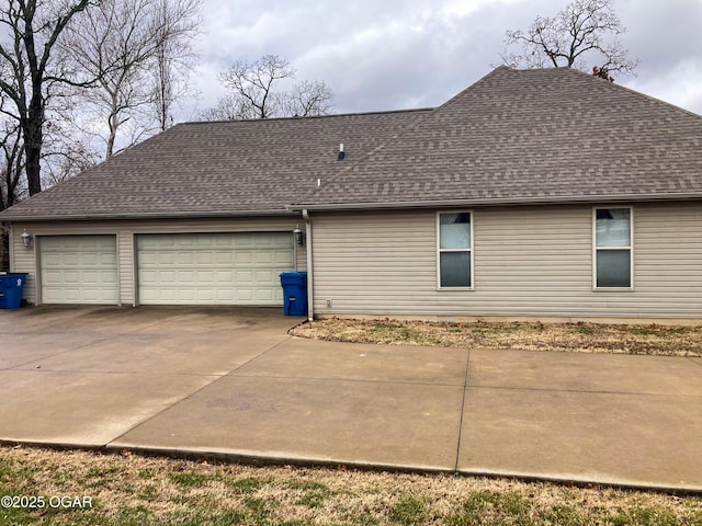 view of side of property featuring a garage