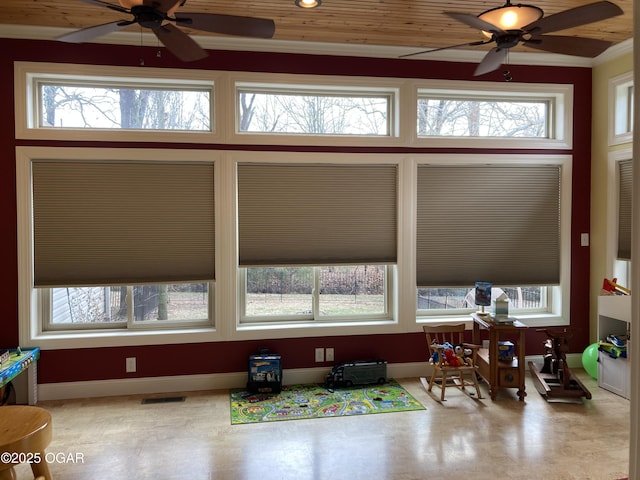 interior space with plenty of natural light and ceiling fan