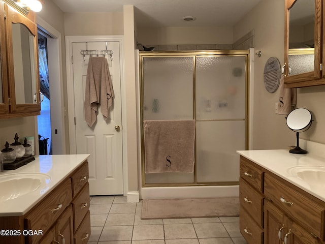 bathroom with vanity, tile patterned floors, and walk in shower