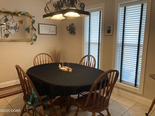 dining room with plenty of natural light and light tile patterned floors