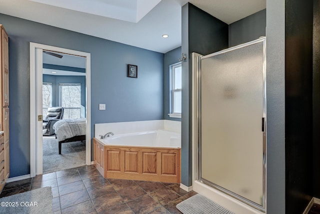 bathroom with separate shower and tub