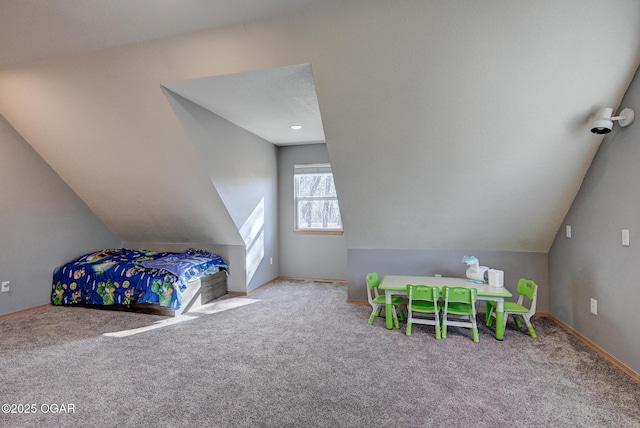 bedroom with vaulted ceiling and carpet