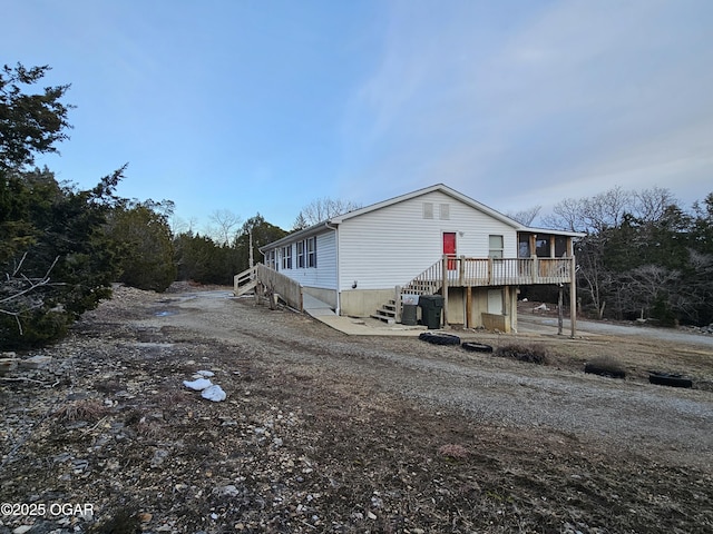 view of front of property featuring a wooden deck