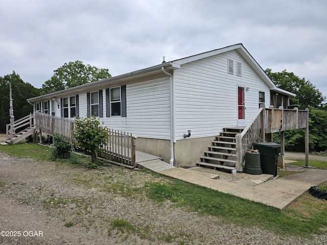 979 S Matherly Rd, Protem, MO 65733 - view of home's exterior with stairway and a wooden deck