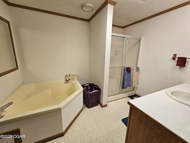 979 S Matherly Rd, Protem, MO 65733 - bathroom featuring tile patterned floors, a textured ceiling, a shower stall, a garden tub, and crown molding